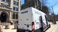 Toronto police's Explosive Unit can be seen outside Queen's Park on Tuesday after a package of powdered gravy was delivered. (Siobhan Morris)