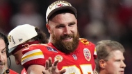 FILE - Kansas City Chiefs tight end Travis Kelce (87) waves after the NFL Super Bowl 58 football game against the San Francisco 49ers Sunday, Feb. 11, 2024, in Las Vegas. The tight end is the host of a new game show called “Are You Smarter Than a Celebrity” for Prime Video. (AP Photo/Frank Franklin II, File)