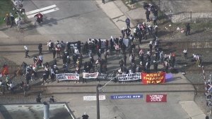 Protesters are shown blocking some rail tracks in Toronto's west end on April 16.