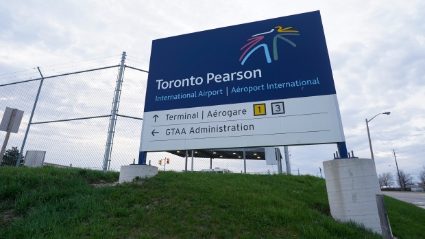 A sign for Toronto Pearson International Airport is pictured in Mississauga, Ont., on Thursday, April 20, 2023. THE CANADIAN PRESS/Arlyn McAdorey