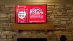 FILE - Signage for Tim Hortons' Roll Up the Rim contest is seen inside a Tim Hortons restaurant in Toronto, Friday, March 6, 2020. THE CANADIAN PRESS/Cole Burston 