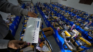 An official holds a mock ballot paper as he prepares bags of election material to be distributed along with the Electronic Voting Machines (EVMs) ahead of the national parliamentary elections in Jorhat, India, Wednesday, April 17, 2024. THE CANADIAN PRESS/AP/Anupam Nath