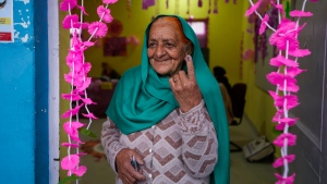 An elderly woman shows the indelible ink mark on her finger after casting vote at women only booth during the first round of polling of Indiaâ€™s national election in Doda district, Jammu and Kashmir, India, Friday, April 19, 2024. (AP Photo/Channi Anand)