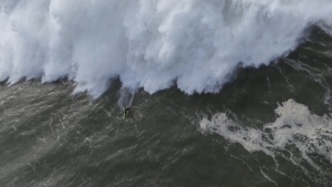 Surfer rides monster 28.57 metre wave