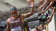 Andre De Grasse receives high fives from fans during the men's 200-metre heat at the World Athletics Championships in Budapest, Hungary, Wednesday, Aug. 23, 2023. Brave is unbeatable is the theme for Canada's Olympic team competing in Paris this summer. The Canadian Olympic Committee and broadcast rightsholder CBC unveiled the marketing campaign today. THE CANADIAN PRESS/AP/Ashley Landis