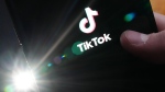 TikTok is testing an app that rivals Instagram in Canada. The TikTok startup page is displayed on an iPhone in Ottawa, Monday, Feb. 27, 2023. THE CANADIAN PRESS/Sean Kilpatrick