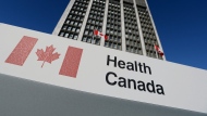 FILE - A sign is displayed in front of Health Canada headquarters in Ottawa, Friday, Jan. 3, 2014. THE CANADIAN PRESS/Sean Kilpatrick