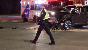 An officer on scene of a collision in Etobicoke that sent five, including one child, to hospital on April 20, 2024. (Jacob Estrin / CP24)