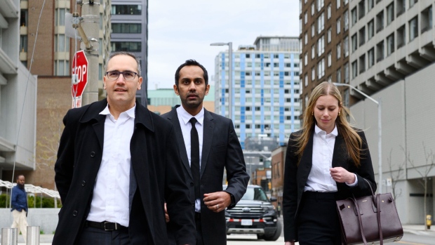Umar Zameer and his lawyers walk away from the courthouse following his not guilty verdict, in Toronto, Sunday, April 21, 2024. THE CANADIAN PRESS/Christopher Katsarov