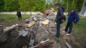 People look at fragments of the television tower which was broken in half after it was hit by a Russian missile in Kharkiv, Ukraine, Monday, April 22, 2024. (Andrii Marienko / AP Photo)