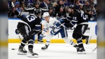Toronto Maple Leafs right wing William Nylander (88) gets between Tampa Bay Lightning left wing Nick Paul (20) and defenseman Darren Raddysh (43) during the third period of an NHL hockey game Wednesday, April 17, 2024, in Tampa, Fla. (AP Photo/Chris O'Meara)