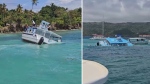The boat is seen taking on water in these still images taken from a video provided to CP24. (Brock MacKenzie).