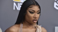 FILE - Megan Thee Stallion arrives at the Billboard Music Awards at the MGM Grand Garden Arena, May 15, 2022, in Las Vegas. A photographer who worked for the hip-hop star said in a lawsuit filed Tuesday, April 23, 2024, that he was forced to watch her have sex, was unfairly fired soon after and was abused as her employee. (Photo by Jordan Strauss/Invision/AP, File)