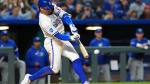 Kansas City Royals' Bobby Witt Jr. hits a two-run double during the fifth inning of a baseball game against the Toronto Blue Jays Tuesday, April 23, 2024, in Kansas City, Mo. (AP Photo/Charlie Riedel)
