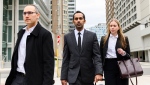 Umar Zameer and his lawyers walk away from the courthouse following his not guilty verdict, in Toronto, Sunday, April 21, 2024. The office of Canada's justice minister says the public should expect politicians to support their right to bail and to be presumed innocent - warning that "immediate" and "uninformed reactions" only worsens matters. THE CANADIAN PRESS/Christopher Katsarov
