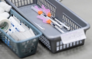 A basket of needles containing COVID-19 vaccines waits to be administered to patients at a COVID-19 clinic in Ottawa on March 30, 2021. THE CANADIAN PRESS/Sean Kilpatrick
