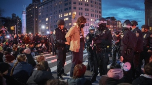 Police arrest protesters as they block traffic during a pro-Palestinian demonstration in the Brooklyn borough of New York, Tuesday, April 23, 2024. (Andres Kudacki / AP Photo)