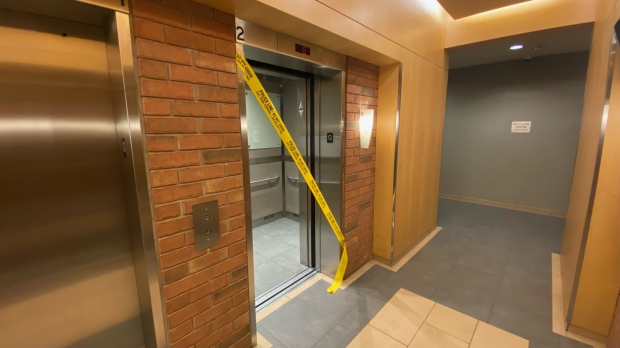 Yellow police tape cordons off an elevator at a rental building near Church and Shuter streets Thursday April, 25, 2024, a day after someone died following a fall from a balcony there. (Scott Lightfoot /CTV News Toronto)