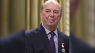 Bob Cole attends an Order of Canada ceremony at Rideau Hall, Friday September 23, 2016 in Ottawa. Broadcaster Cole, a welcome voice for Canadian hockey fans for a half-century, has died at the age of 90.THE CANADIAN PRESS/Adrian Wyld