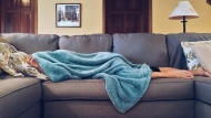 A file photo of a person stuck on the couch while sick (Pexels). According to the Public Health Agency of Canada, norovirus is spreading at a higher frequency than expected.