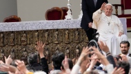 Pope Francis waves to faithful at the end of a mass in St. Mark's Square, Venice, Italy, Sunday, April 28, 2024. (AP Photo/Antonio Calanni)