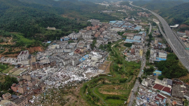 In this photo provided by China's Xinhua News Agency, an aerial view shows damaged buildings in the aftermath of a tornado in Guangming Village of Zhongluotan Town, Baiyun District, Guangzhou, south China's Guangdong Province, Sunday, April 28, 2024. (Deng Hua/Xinhua via AP)