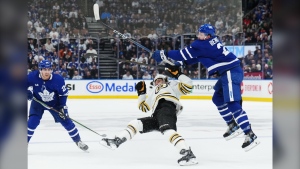 Stakes are sky-high and intensity ramps up as hockey's silver chalice chase starts in earnest, but the physicality this spring has touched a new level — especially in the Atlantic Division. Toronto Maple Leafs' Simon Benoit (2) checks Boston Bruins' David Pastrnak (88) as Maple Leafs' Connor Dewar (24) looks on during first period action in Game 3 of an NHL hockey Stanley Cup first-round playoff series in Toronto on Wednesday, April 24, 2024. THE CANADIAN PRESS/Nathan Denette