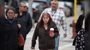 Donna Bartlett (centre), the grandmother of Marcedes Myran, walks to the Court of King’s Bench of Manitoba building in downtown Winnipeg, where the trial of Jeremy Skibicki, the man accused of killing Myran and three other women is set to begin, on Monday, April 29, 2024. THE CANADIAN PRESS/Daniel Crump.