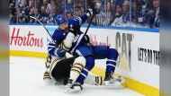 Boston Bruins' Charlie McAvoy takes down Toronto Maple Leafs' Auston Matthews during NHL playoff action in Toronto on Wednesday, April 24, 2024. Matthews will be alongside his teammates in Boston. Whether the Maple Leafs sniper is on the ice with Toronto facing elimination is a massive question mark. THE CANADIAN PRESS/Nathan Denette