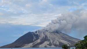 In this photo released by the Vulcanology and Geological Disaster Mitigation Center (PVMBG) of the Indonesian Ministry of Energy and Mineral Resources, Mount Ruang releases volcanic materials during its eruption on Wednesday, May 1, 2024, on Sulawesi Island, Indonesia. (PVMBG via AP Photo)