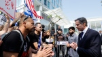 U.S. Secretary of State Antony Blinken, right, meets with the families and supporters of the hostages held by Hamas, outside of a hotel, in Tel Aviv, Israel, Wednesday, May 1, 2024. (Evelyn Hockstein/Pool Photo via AP) 