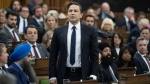 Conservative Leader Pierre Poilievre rises in response to the Speaker asking him to withdraw language during Question Period, Tuesday, April 30, 2024 in Ottawa. Conservative MPs are calling on Commons Speaker Greg Fergus to resign after ejecting their leader during a heated debate, where they say equal rules were not applied to Prime Minister Justin Trudeau. THE CANADIAN PRESS/Adrian Wyld