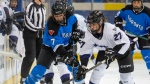 Toronto's Olivia Knowles (7) and Minnesota's Taylor Heise (27) battle for the puck during first period PWHL action in Toronto on Wednesday, May 1, 2024. THE CANADIAN PRESS/Frank Gunn