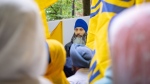 A portrait of Hardeep Singh Nijjar is seen as protesters gather outside the Consulate of India in response to his shooting death, in Vancouver, B.C., Saturday, June 24, 2023. THE CANADIAN PRESS/Ethan Cairns