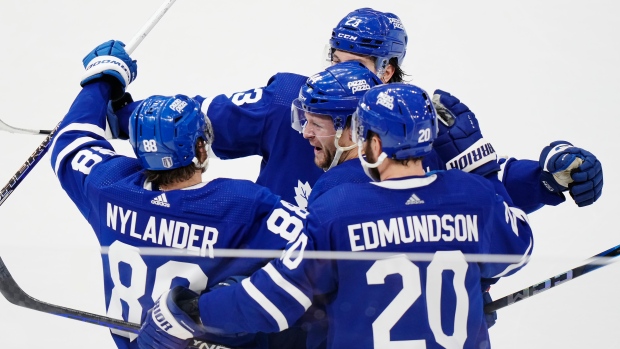 Toronto Maple Leafs forward William Nylander (88) celebrates his goal against the Boston Bruins with Morgan Rielly (44), Matthew Knies (23) and Joel Edmundson (20) during third-period action in Game 6 of an NHL hockey Stanley Cup first-round playoff series in Toronto on Thursday, May 2, 2024. THE CANADIAN PRESS/Frank Gunn
