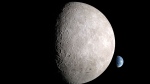 An illustration depicts the far side of the moon, with Earth behind it. (NASA via CNN Newsource)
