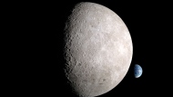 An illustration depicts the far side of the moon, with Earth behind it. (NASA via CNN Newsource)