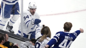 Toronto Maple Leafs centre Auston Matthews (34) celebrates after his goal against Boston Bruins goaltender Linus Ullmark during the third period of Game 2 of an NHL hockey Stanley Cup first-round playoff series, Monday, April 22, 2024, in Boston. THE CANADIAN PRESS/AP-Charles Krupa