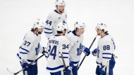 Toronto Maple Leafs' Mitch Marner (16), William Nylander (88), Auston Matthews (34), Timothy Liljegren (37) and Morgan Rielly (44) talk before a face off during the second period of Game 7 of an NHL hockey Stanley Cup first-round playoff series against the Boston Bruins, Saturday, May 4, 2024, in Boston. (AP Photo/Michael Dwyer)
