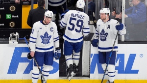 Toronto Maple Leafs' Tyler Bertuzzi (59) leaves the ice between John Tavares (91) and Morgan Rielly (44) after the team lost to the Boston Bruins in overtime during Game 7 of an NHL hockey Stanley Cup first-round playoff series, Saturday, May 4, 2024, in Boston. (AP Photo/Michael Dwyer)