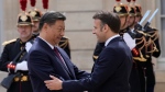 French President Emmanuel Macron, right, welcomes China's President Xi Jinping before their meeting at the Elysee Palace, Monday, May 6, 2024 in Paris. (Christophe Ena / AP Photo)