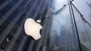FILE - In this June 16, 2020 file photo, the sun is reflected on Apple's Fifth Avenue store in New York. Apple will reports earnings on Thursday May 2, 2024. (AP Photo/Mark Lennihan, File)