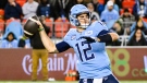 Toronto Argonauts quarterback Chad Kelly (12) throws the ball for a touchdown pass to wide receiver DaVaris Daniels (80) during second half CFL action in Toronto, Saturday, Oct. 14, 2023. THE CANADIAN PRESS/Christopher Katsarov 