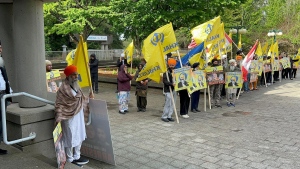 Members of British Columbia's Sikh community gather in front of the courthouse in Surrey, B.C., Tuesday, May 7, 2024. Three men accused of murdering temple leader Hardeep Singh Nijjar made their first court appearance by video. THE CANADIAN PRESS/Chuck Chiang