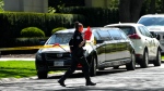Toronto Police investigate a crime scene outside the mansion of Canadian rap mogul Drake in Toronto's Bridle Path neighbourhood, Tuesday, May 7, 2024. Paramedics said a security guard working outside the home was taken to hospital with serious but non-life-threatening injuries in an overnight shooting. THE CANADIAN PRESS/Nathan Denette 