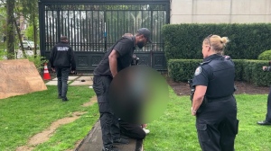 Police handcuff man outside Drake's mansion