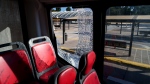 A bus parked outside Constitution Station has a broken window after someone threw a rock at it during a general strike against the reforms of President Javier Milei in Buenos Aires, Argentina, Thursday, May 9, 2024. (AP Photo/Cristian Kovadloff) 