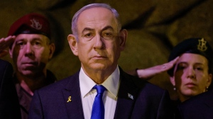Israeli Prime Minister Benjamin Netanyahu, front, attends a wreath-laying ceremony marking Holocaust Remembrance Day in the Hall of Remembrance at Yad Vashem, the World Holocaust Remembrance Centre, in Jerusalem, Israel, Monday, May 6, 2024. (Amir Cohen/Pool Photo via AP) 