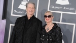FILE - Musician Brian Wilson, left, and his wife Melinda Ledbetter Wilson arrive at the 55th annual Grammy Awards on Sunday, Feb. 10, 2013, in Los Angeles. (Photo by Jordan Strauss/Invision/AP, File)