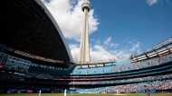 The CN Tower looms over the Toronto Blue Jays and Detroit Tigers in Toronto, Saturday, May 7, 2011. THE CANADIAN PRESS/Darren Calabrese 